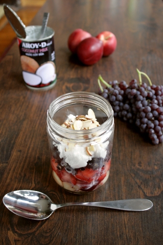 layered fruit salad with whipped coconut cream